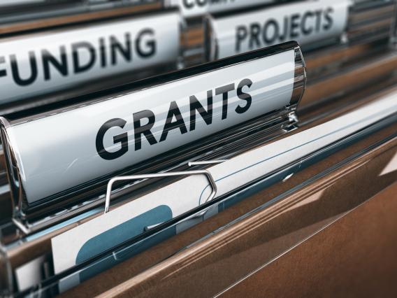 hanging file folders labeled grants, funding and projects